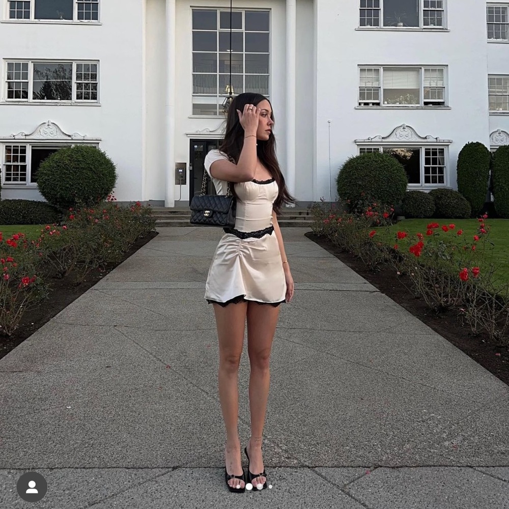 Elegant Cream Dress with Black Accents